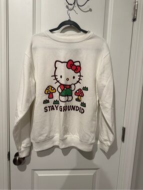 Hello Kitty Cream Crewneck Sweatshirt with Red Bow & Green Overalls